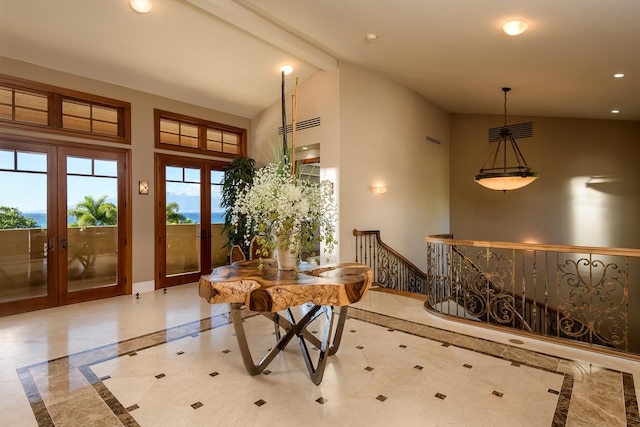 interior space with high vaulted ceiling, beam ceiling, and french doors