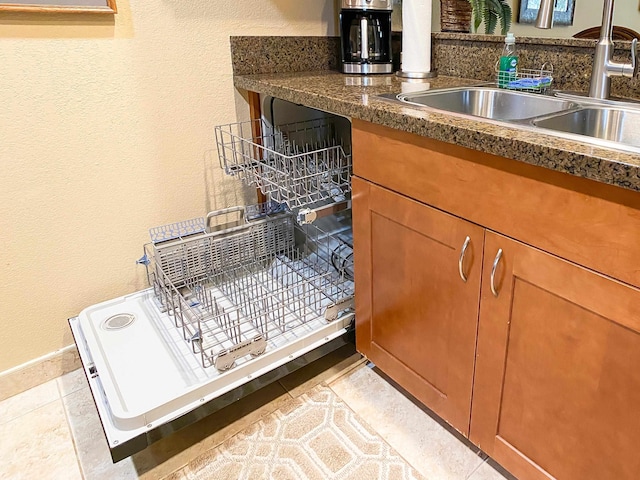 interior space featuring sink and light tile floors