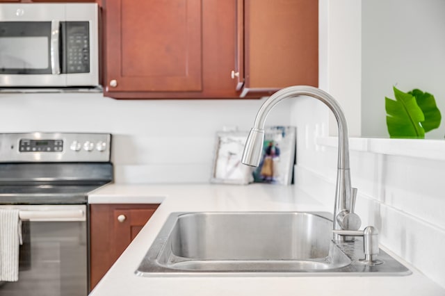 kitchen featuring range and sink