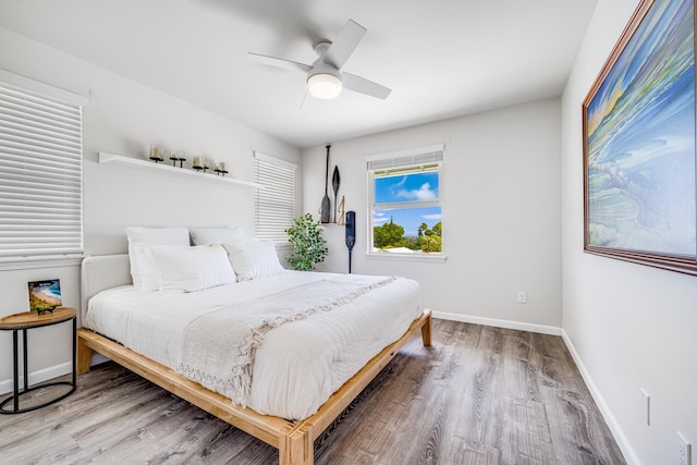 bedroom featuring ceiling fan and hardwood / wood-style floors