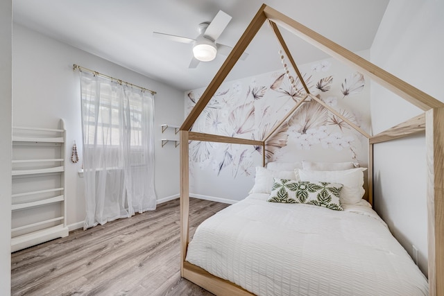 bedroom featuring wood-type flooring and ceiling fan