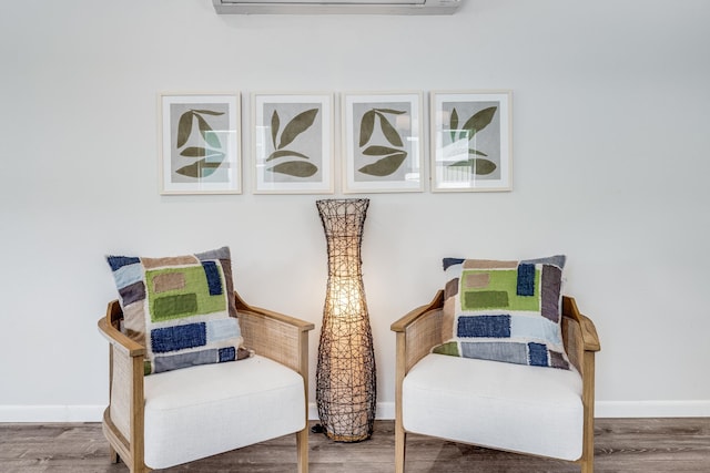 sitting room featuring hardwood / wood-style floors