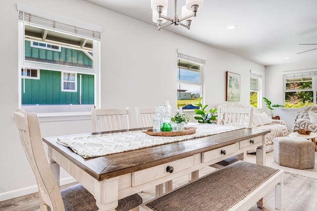 dining area with a chandelier and hardwood / wood-style floors