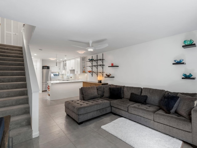 68 Walaka St Unit 5, Kihei, HI 96753 - living room with stairway, light tile patterned floors, and a ceiling fan