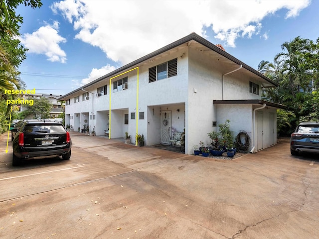 68 Walaka St Unit 5, Kihei, HI 96753 - view of property exterior featuring stucco siding and uncovered parking