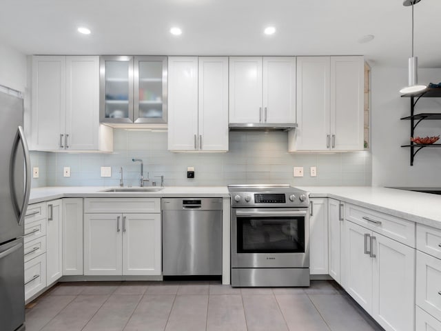 68 Walaka St Unit 5, Kihei, HI 96753 - kitchen featuring appliances with stainless steel finishes, white cabinets, light countertops, tasteful backsplash, and recessed lighting