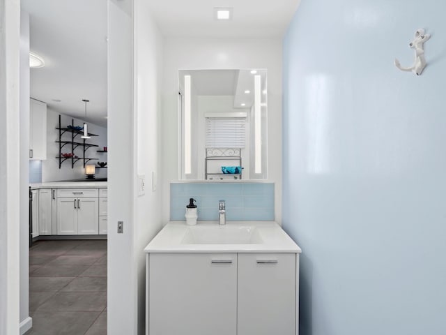 68 Walaka St Unit 5, Kihei, HI 96753 - bathroom featuring vanity, backsplash, and tile patterned floors