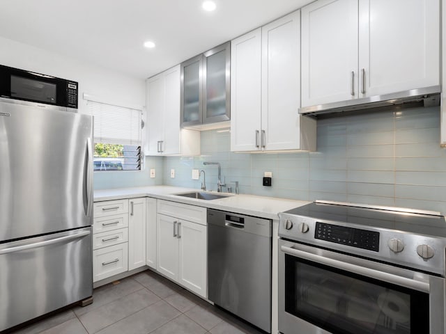 68 Walaka St Unit 5, Kihei, HI 96753 - kitchen with stainless steel appliances, light tile patterned floors, light countertops, white cabinets, and recessed lighting