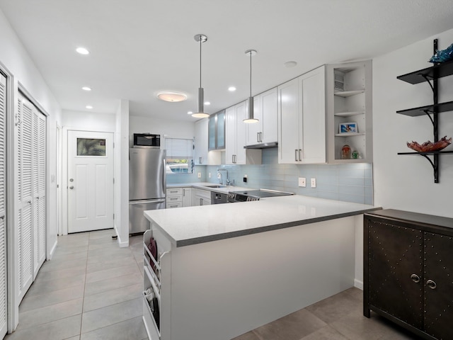 68 Walaka St Unit 5, Kihei, HI 96753 - kitchen with appliances with stainless steel finishes, open shelves, a peninsula, white cabinets, and light tile patterned floors