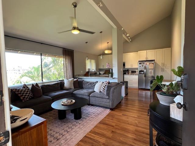15 Kulanihakoi St Unit 9E, Kihei, HI 96753 - living area with ceiling fan, wood finished floors, and high vaulted ceiling