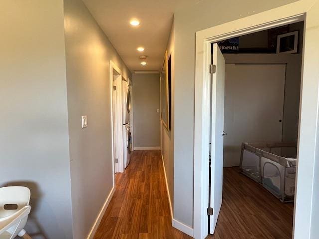 15 Kulanihakoi St Unit 9E, Kihei, HI 96753 - corridor with stacked washer and clothes dryer, dark wood-style flooring, baseboards, and recessed lighting