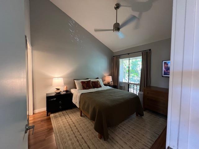 15 Kulanihakoi St Unit 9E, Kihei, HI 96753 - bedroom featuring wood finished floors, high vaulted ceiling, and ceiling fan