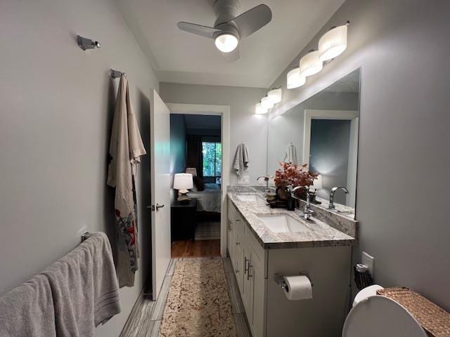 15 Kulanihakoi St Unit 9E, Kihei, HI 96753 - ensuite bathroom featuring ceiling fan, double vanity, and wood finished floors