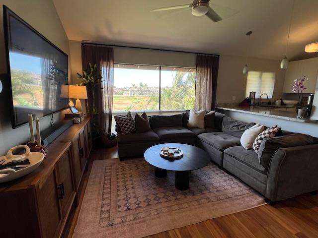 15 Kulanihakoi St Unit 9E, Kihei, HI 96753 - living area featuring wood finished floors, lofted ceiling, plenty of natural light, and a ceiling fan