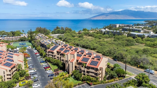 birds eye view of property featuring a water and mountain view