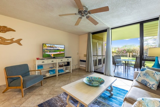 tiled living room featuring floor to ceiling windows, a textured ceiling, and ceiling fan