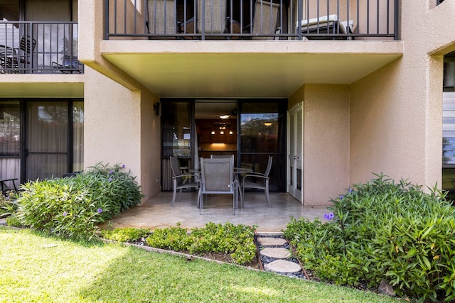 doorway to property featuring a patio area and a balcony