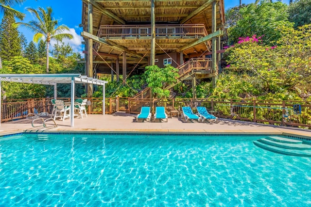 view of pool with a patio area and a pergola