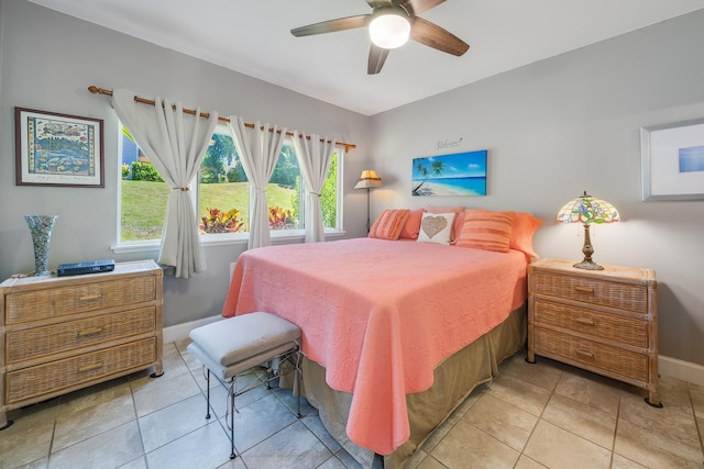 tiled bedroom with ceiling fan