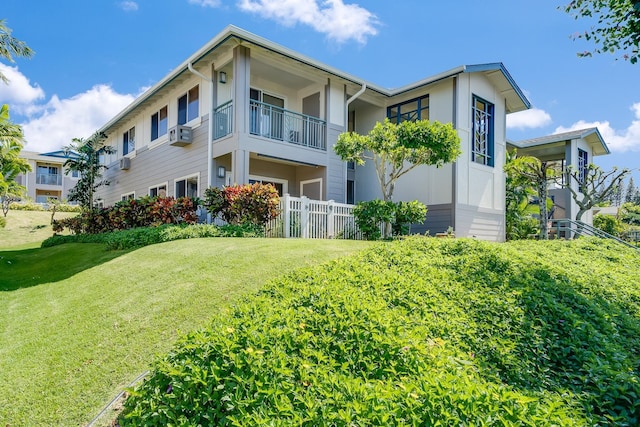 view of side of home with a lawn