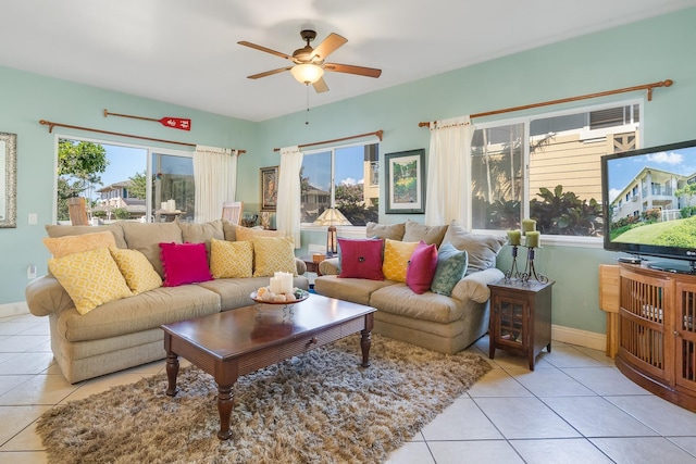 tiled living room with ceiling fan