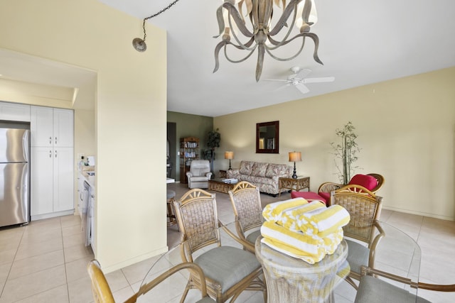 dining area with light tile patterned floors and ceiling fan