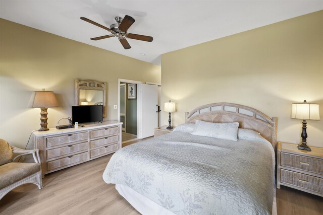 bedroom with ceiling fan and hardwood / wood-style floors