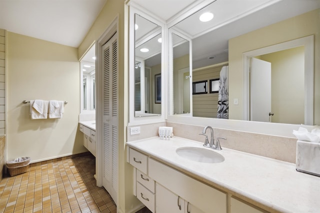 bathroom with vanity and tile patterned flooring