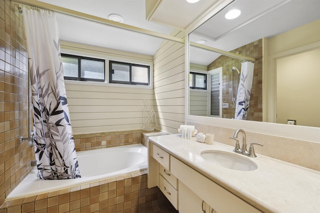 bathroom with vanity, a wealth of natural light, and shower / tub combo with curtain