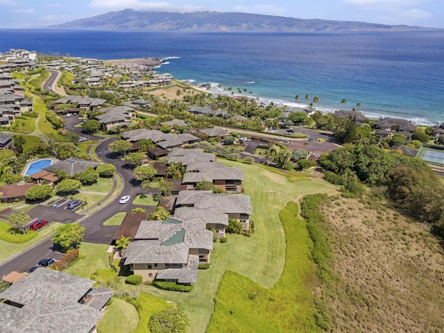 drone / aerial view featuring a water and mountain view