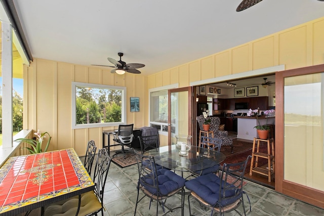 dining space featuring ceiling fan