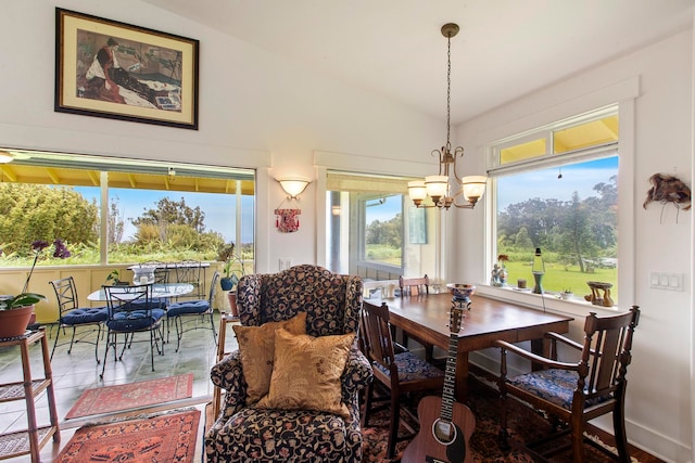 dining area featuring tile patterned flooring, vaulted ceiling, and an inviting chandelier