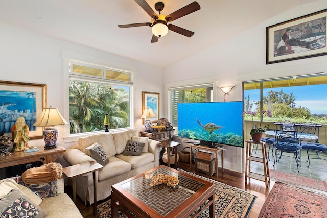 living room featuring lofted ceiling, ceiling fan, and hardwood / wood-style floors