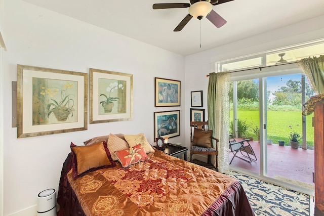 bedroom featuring ceiling fan and access to exterior