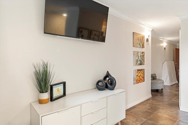 hallway with ornamental molding and tile floors