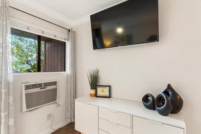 details with a wall unit AC and ornamental molding