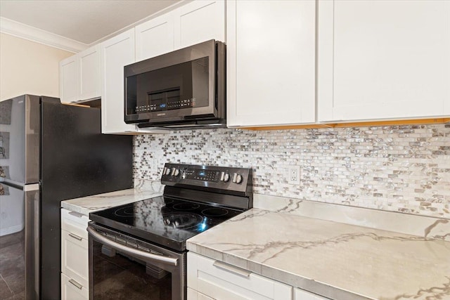 kitchen featuring appliances with stainless steel finishes, crown molding, tasteful backsplash, light stone counters, and white cabinets