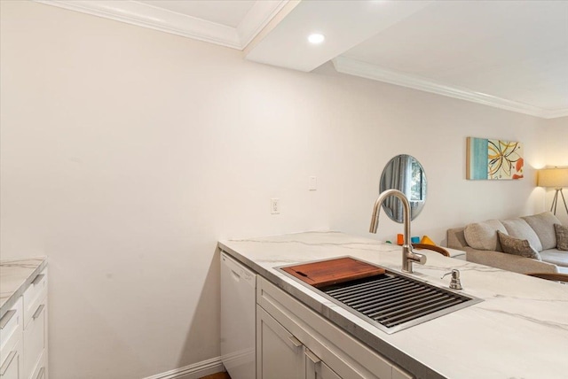 kitchen with white cabinets, sink, ornamental molding, white dishwasher, and light stone countertops