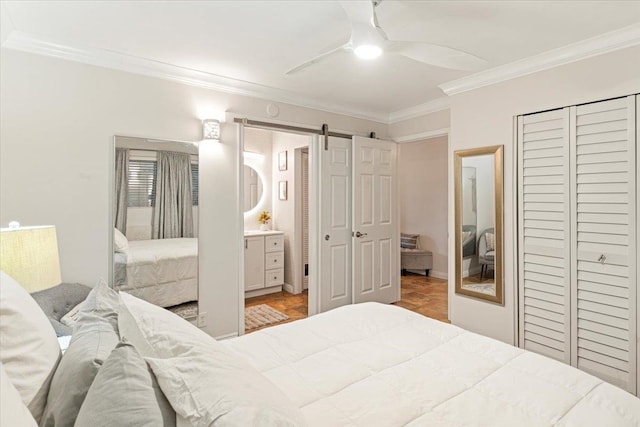 bedroom featuring ceiling fan, parquet floors, crown molding, and a barn door