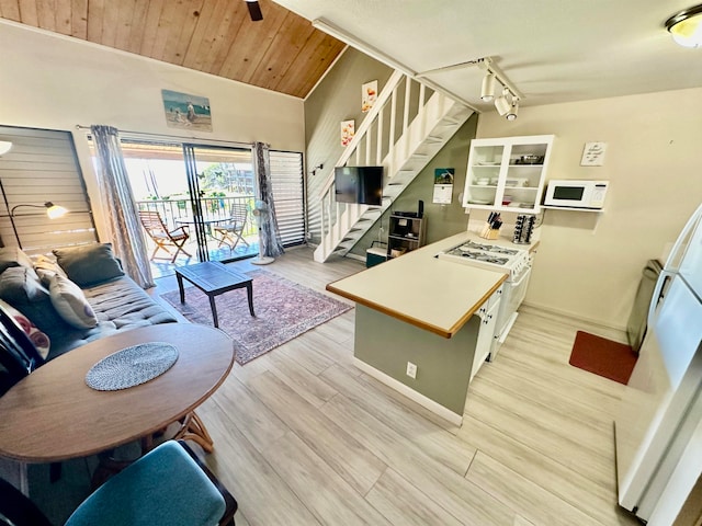 kitchen featuring rail lighting, wooden ceiling, light hardwood / wood-style flooring, vaulted ceiling, and white appliances