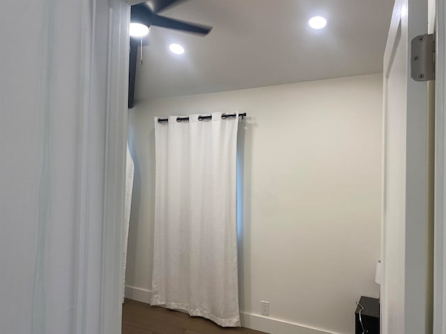 empty room featuring ceiling fan and dark hardwood / wood-style flooring