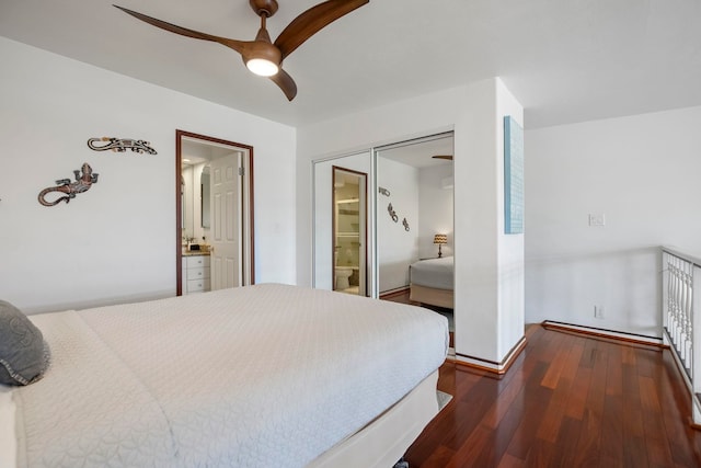 bedroom featuring a ceiling fan, ensuite bath, and dark wood-style flooring