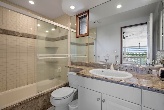 bathroom featuring bath / shower combo with glass door, vanity, toilet, and recessed lighting