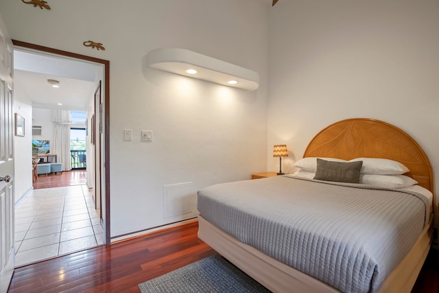 bedroom with wood finished floors