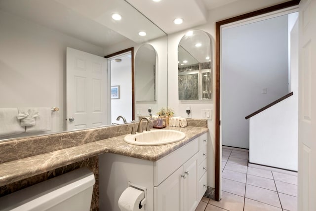 bathroom with recessed lighting, tile patterned flooring, and vanity