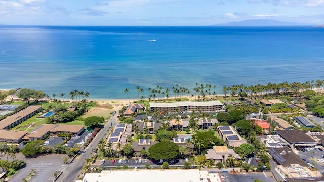 birds eye view of property with a view of the beach and a water view