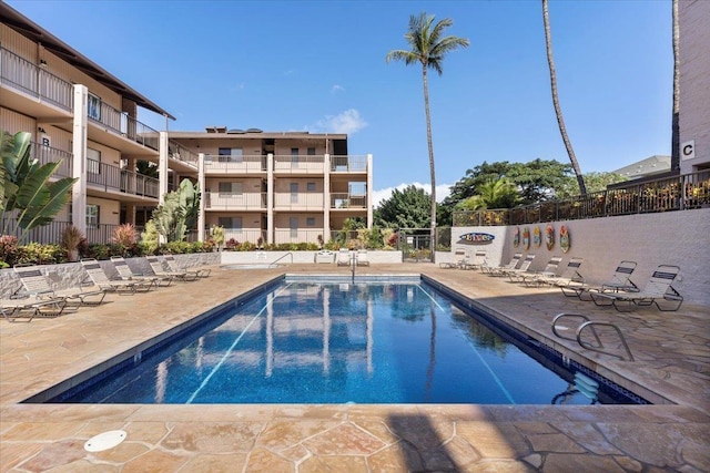 view of swimming pool featuring a patio area