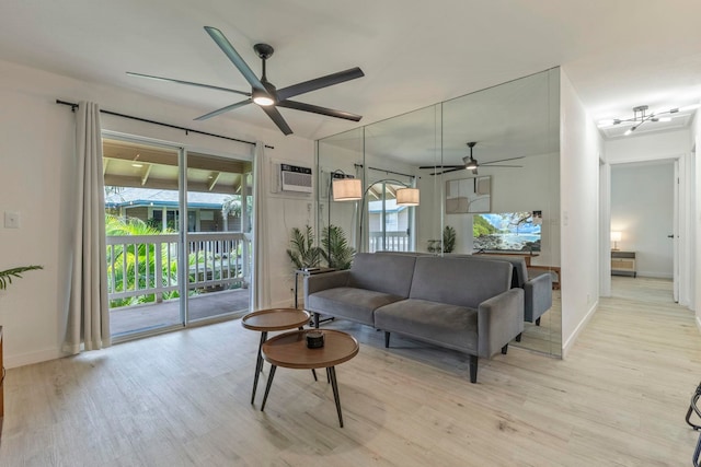 480 Kenolio Rd Unit 24-202, Kihei, HI 96753 - living area with a ceiling fan, light wood-style floors, healthy amount of natural light, and baseboards