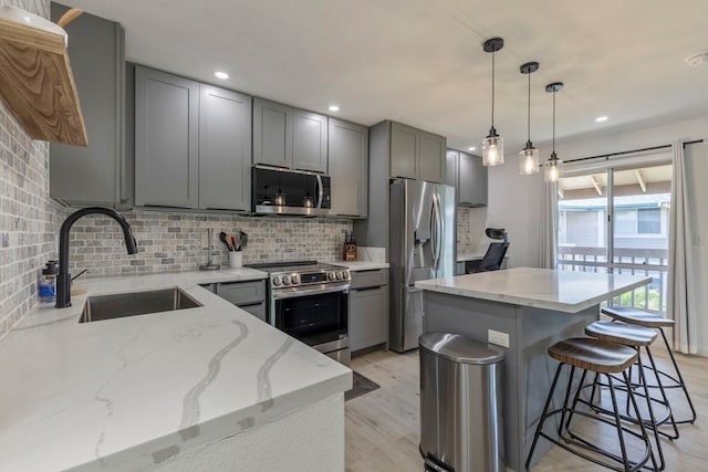 480 Kenolio Rd Unit 24-202, Kihei, HI 96753 - kitchen featuring stainless steel appliances, a sink, gray cabinetry, tasteful backsplash, and recessed lighting