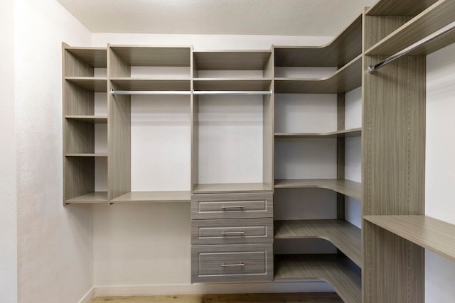 480 Kenolio Rd Unit 24-202, Kihei, HI 96753 - walk in closet featuring dark wood-style floors
